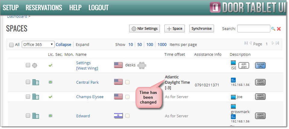 Door Tablet UI Spaces page showing the updated time zone applied to a room.